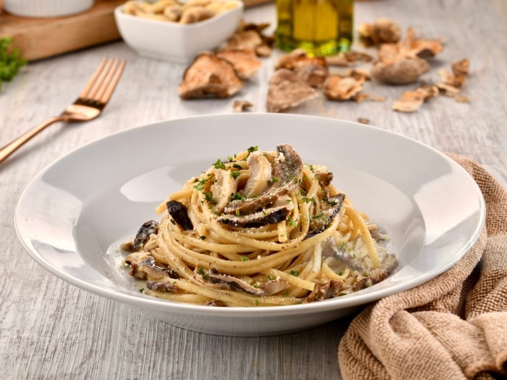 Fresh black truffles shaved over creamy tagliatelle pasta